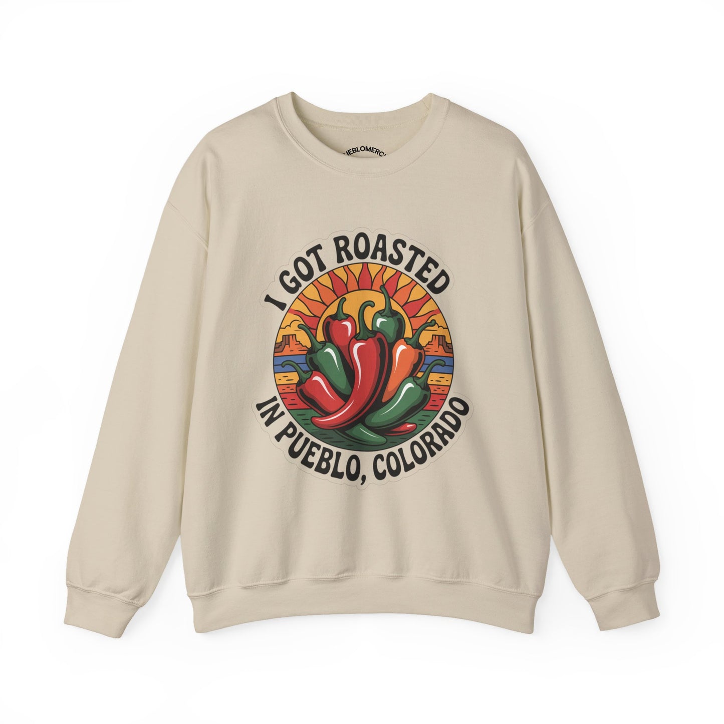Beige sweatshirt with Pueblo roasted chilis graphic and “I Got Roasted in Pueblo, Colorado” text on white background