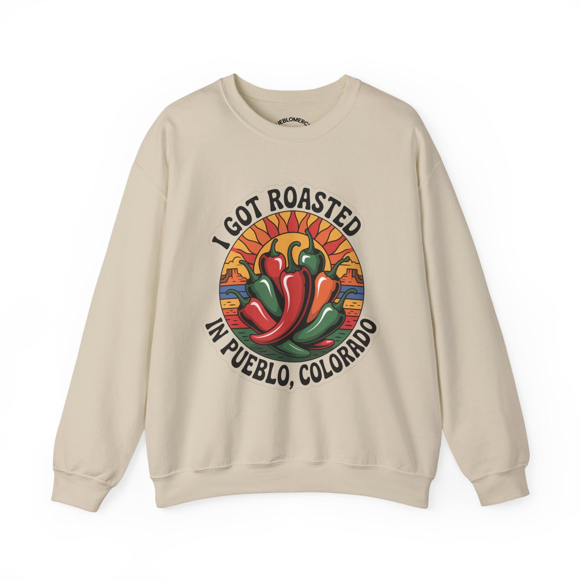 Beige sweatshirt with Pueblo roasted chilis graphic and “I Got Roasted in Pueblo, Colorado” text on white background