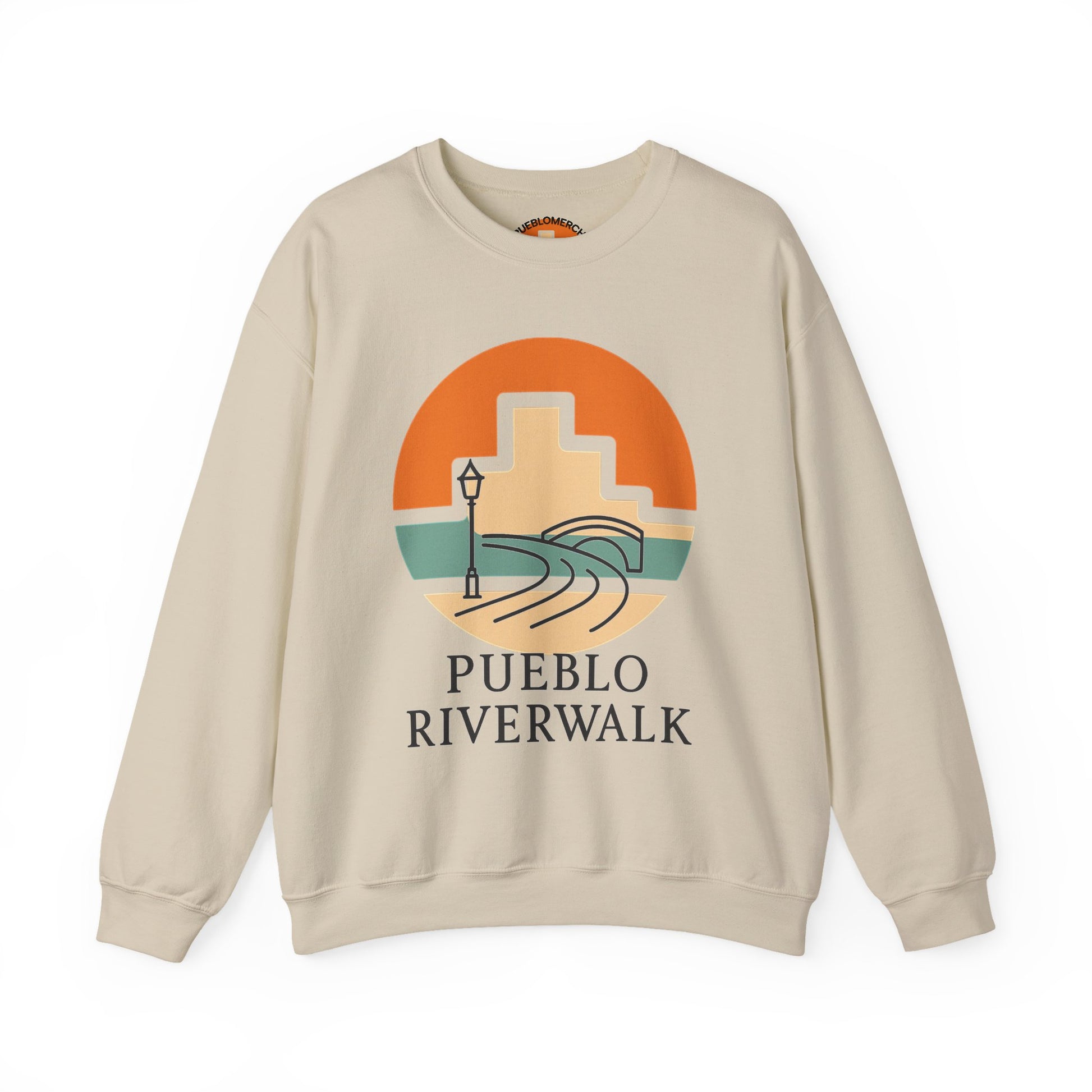 Sand color crewneck sweatshirt with Pueblo Riverwalk sunrise graphic design on front, displayed on white background.