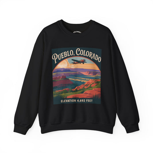 Black sweatshirt with vibrant Pueblo Colorado scenic landscape graphic and yellow 'Pueblo Colorado' text on front, on white background.